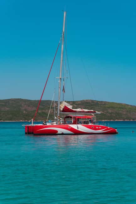 Cruising on a sailing maxi-catamaran - Santa Giulia start: where the day stays simple
