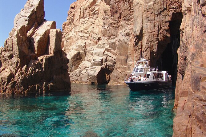 Friendly discovery of Scandola Calanques de Piana and meal stop at Girolata - Genoese tower views and a captain-style geology briefing