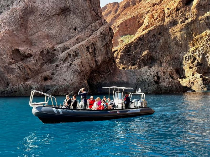 From Sant Ambroggio: Scandola, Girolata & Calanques de Piana - Steering the narrow passages near Scandola’s red volcanic rock